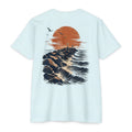 Ice blue Port Aransas Jetty Sunset fishing shirt featuring crashing Gulf waves, granite jetties, seabirds, and a coastal sunset