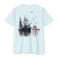 Ice blue vintage shrimp boat sunset fishing shirt featuring a Gulf Coast shrimp trawler on calm coastal waters at sunset