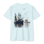 Ice blue vintage shrimp boat sunset fishing shirt featuring a Gulf Coast shrimp trawler on calm coastal waters at sunset